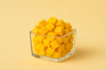 Diced mango in a small glass box