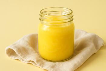 Jar of homemade ghee on a cotton cloth